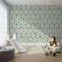 Front view of Whimsy Tots' Dino Tracks Wallpaper in Sage Green