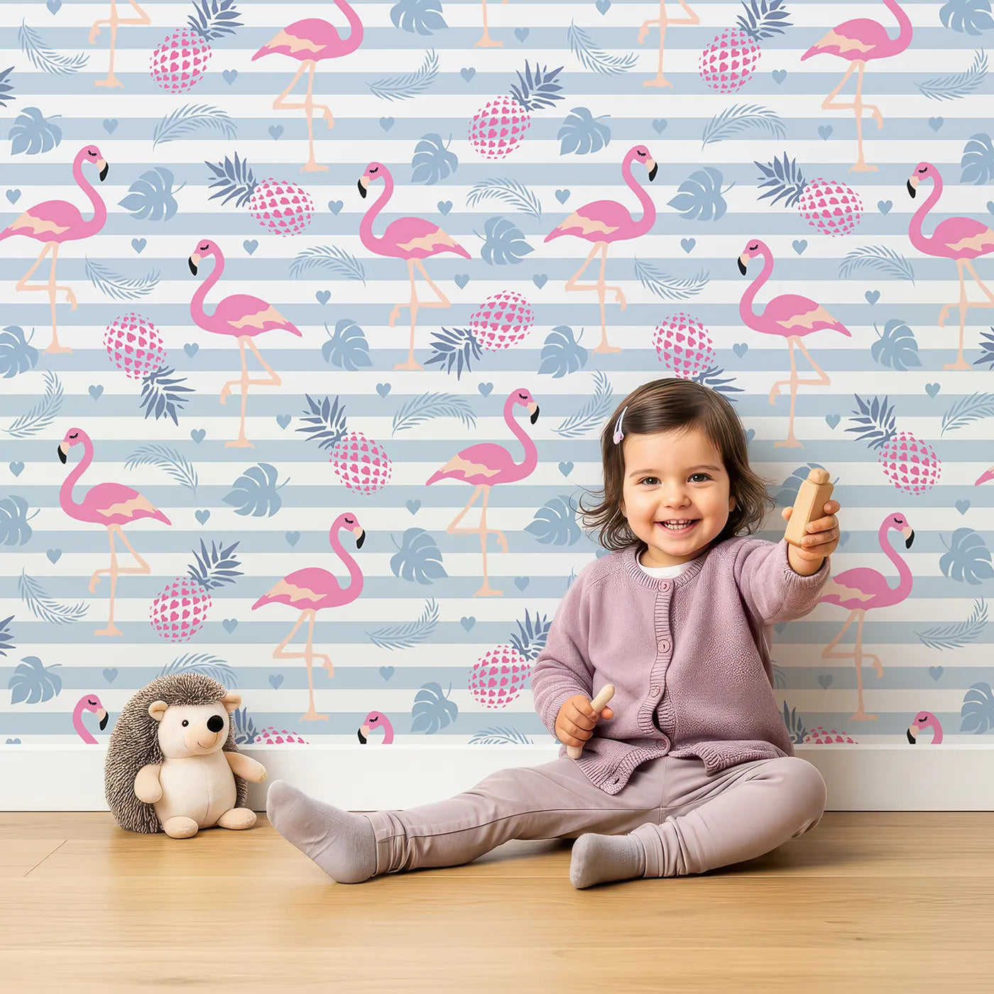 Lovely child standing in front of Whimsy Tots Flamingo Tropics Wallpaper with flamingo, pineapple, heart, stripe, leaf in design.