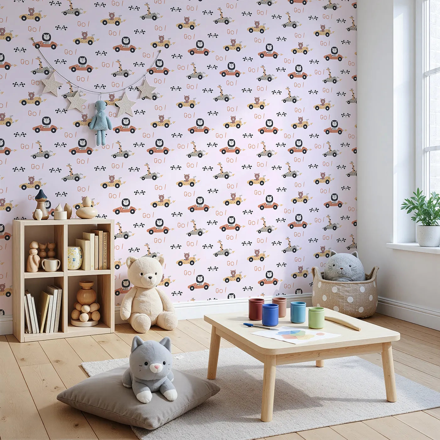 Angled view of Whimsy Tots' Animal Racers Wallpaper in Blush Pink (W3487B).Bears, lions, and giraffes zoom past in pastel cars of fun.