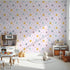 Front view of Whimsy Tots' Dino Stomp Parade Wallpaper in Blush Pink