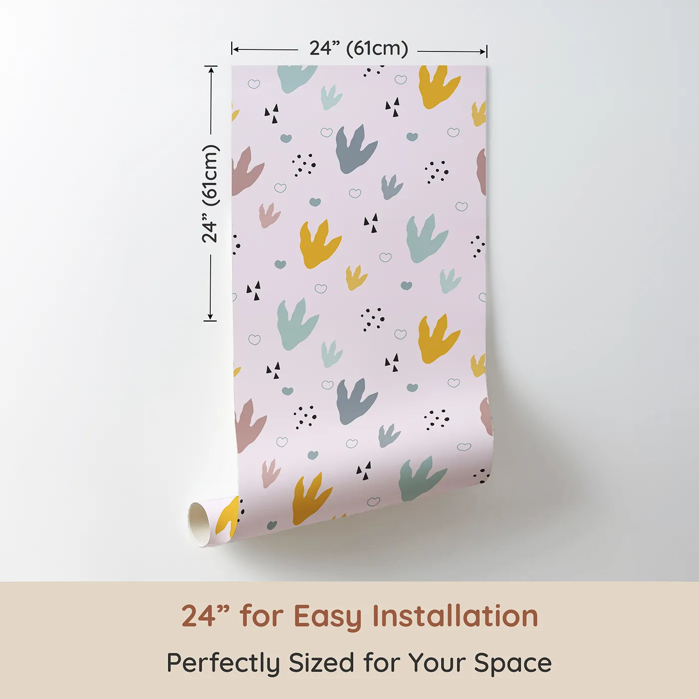 Dimension view of Whimsy Tots Dino Stomp Parade Wallpaper in Blush Pink (W3495B). Printed in 24-inch-wide panel for easy installation. Colorful dinosaur prints pop against a blush pink trail.