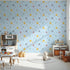 Front view of Whimsy Tots' Dino Stomp Parade Wallpaper in Sky Blue