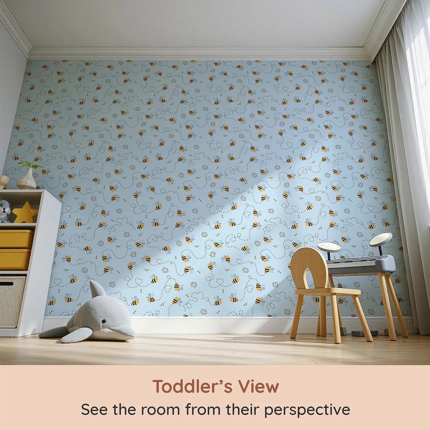 Whimsy Tots Busy Bee Trail Wallpaper in Sky Blue (W3497E) from your child's view.Bees zip joyfully across a soft blue sky with hearts and garden blooms.