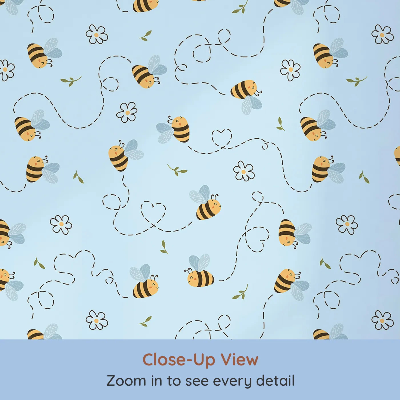 Close-up view of Whimsy Tots' Busy Bee Trail Wallpaper in Sky Blue (W3497E).Bees zip joyfully across a soft blue sky with hearts and garden blooms.