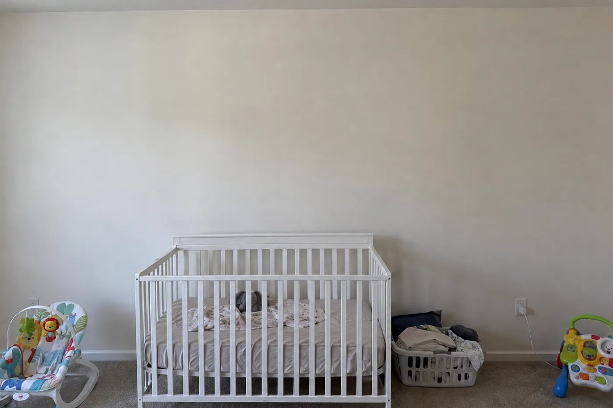 Gouache wallpaper of baby elephants, giraffes and zebras on warm cream, the same room before, by Whimsy Tots