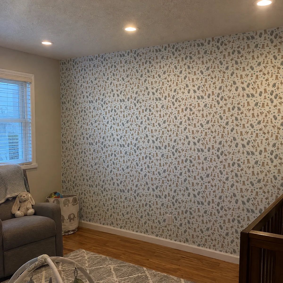 Storybook wallpaper of meerkats, elephant calves and ostrich chicks, in a room photo, by Whimsy Tots