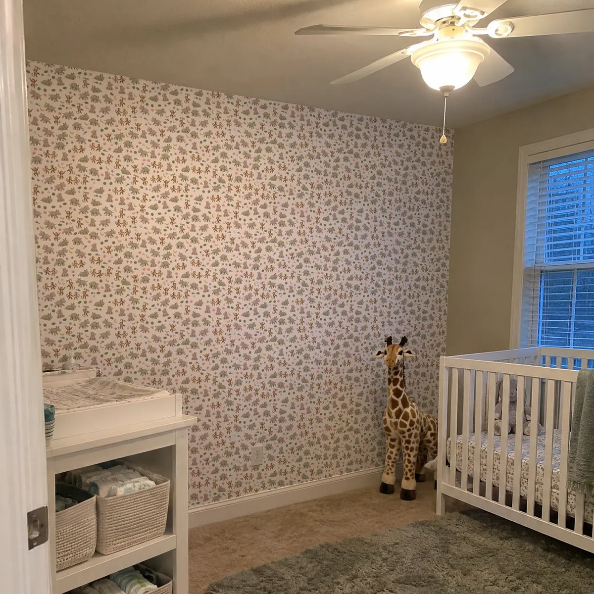 Gouache safari animal wallpaper for a nursery, in a room photo, by Whimsy Tots