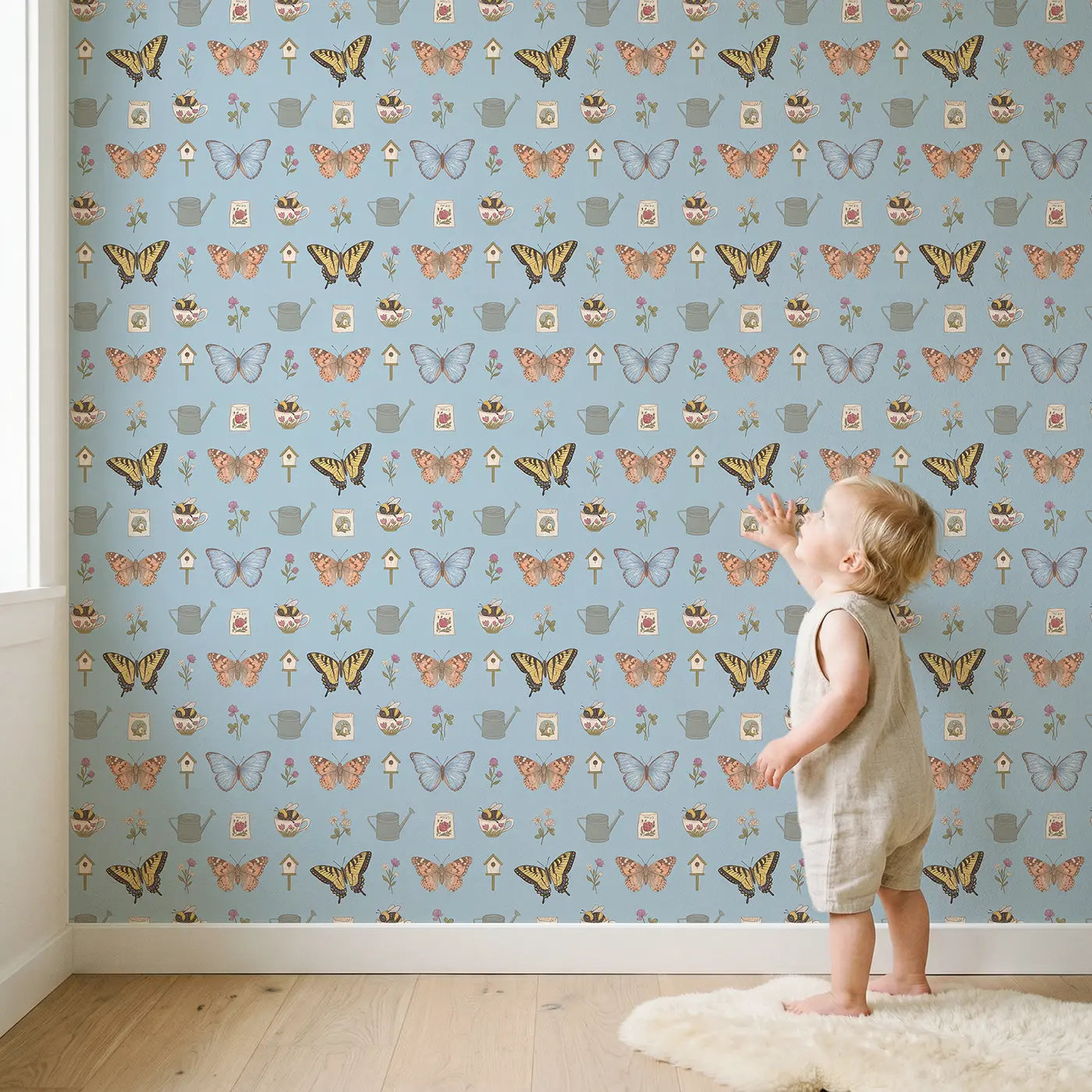 Blue Morpho Gliding Ditsy Floral wallpaper in styled kids room - Whimsy Tots