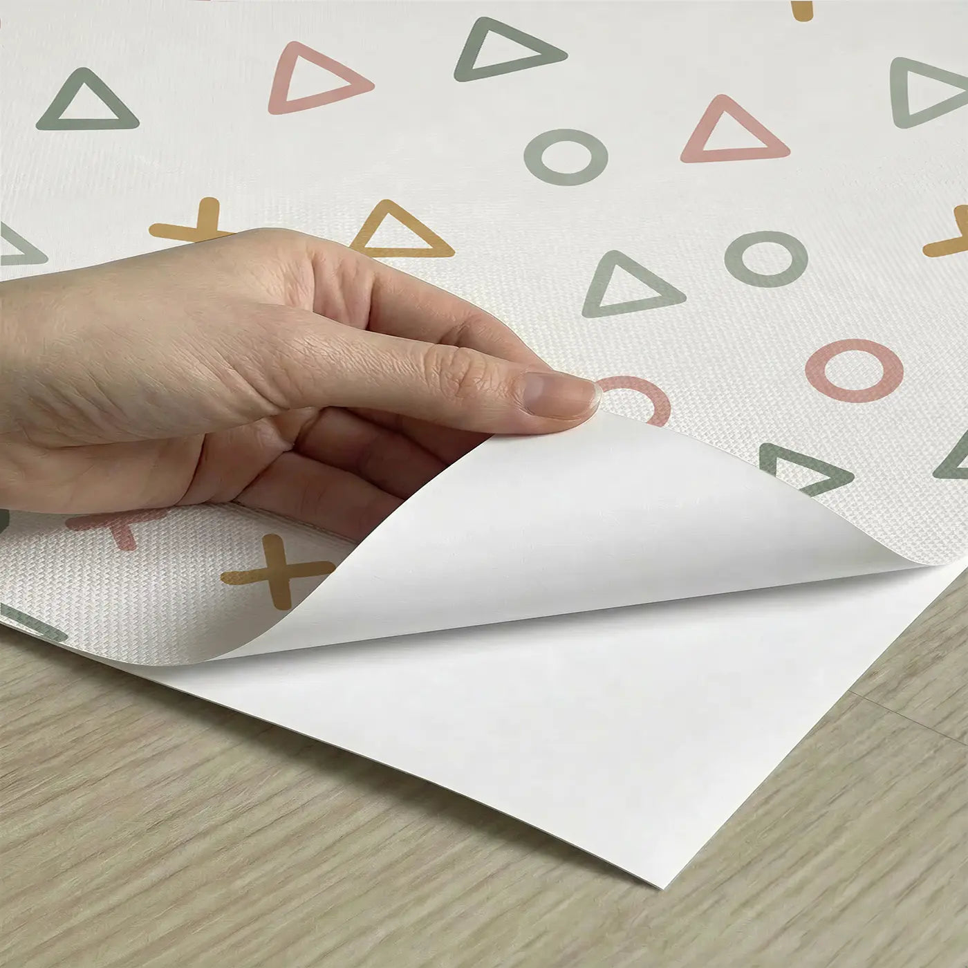 Scattered Triangles Geometric peel and stick material close-up - Whimsy Tots