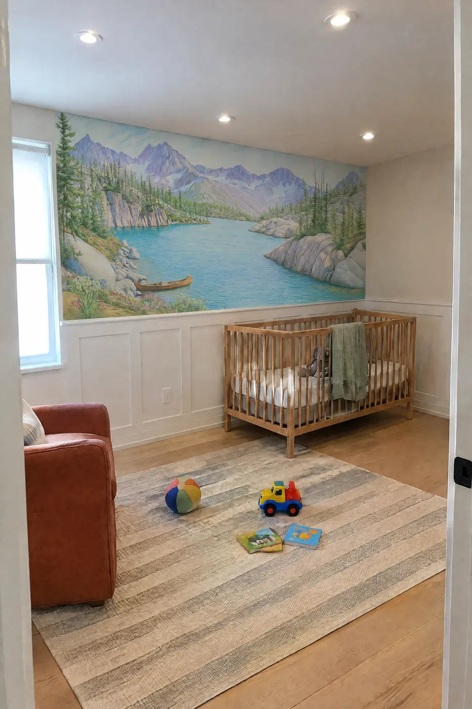 The Turquoise Tarn Wainscoting Wallpaper in a nursery by Whimsy Tots
