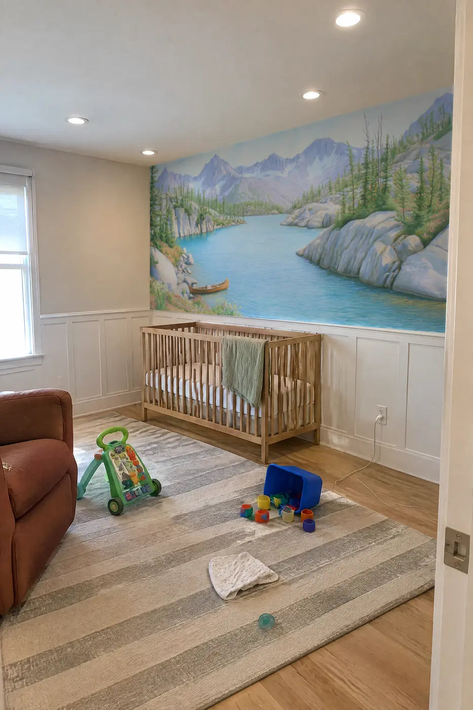 The Turquoise Tarn Wainscoting Wallpaper in a nursery by Whimsy Tots